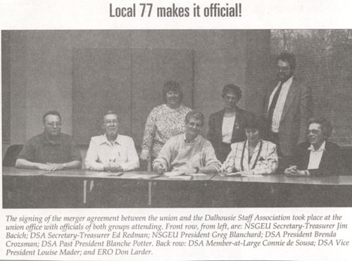 NSGEU members signing at a table